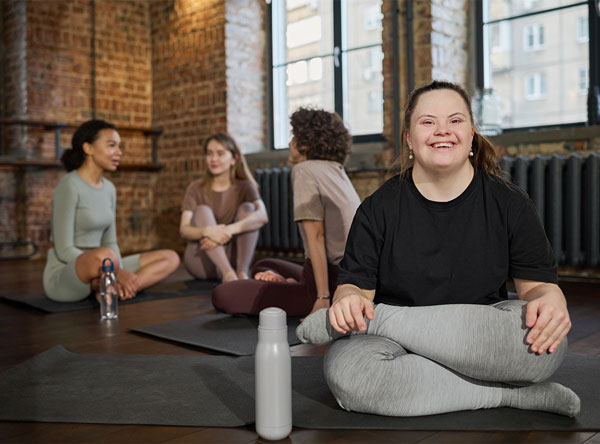 An adult taking part in an inclusive community exercise activity