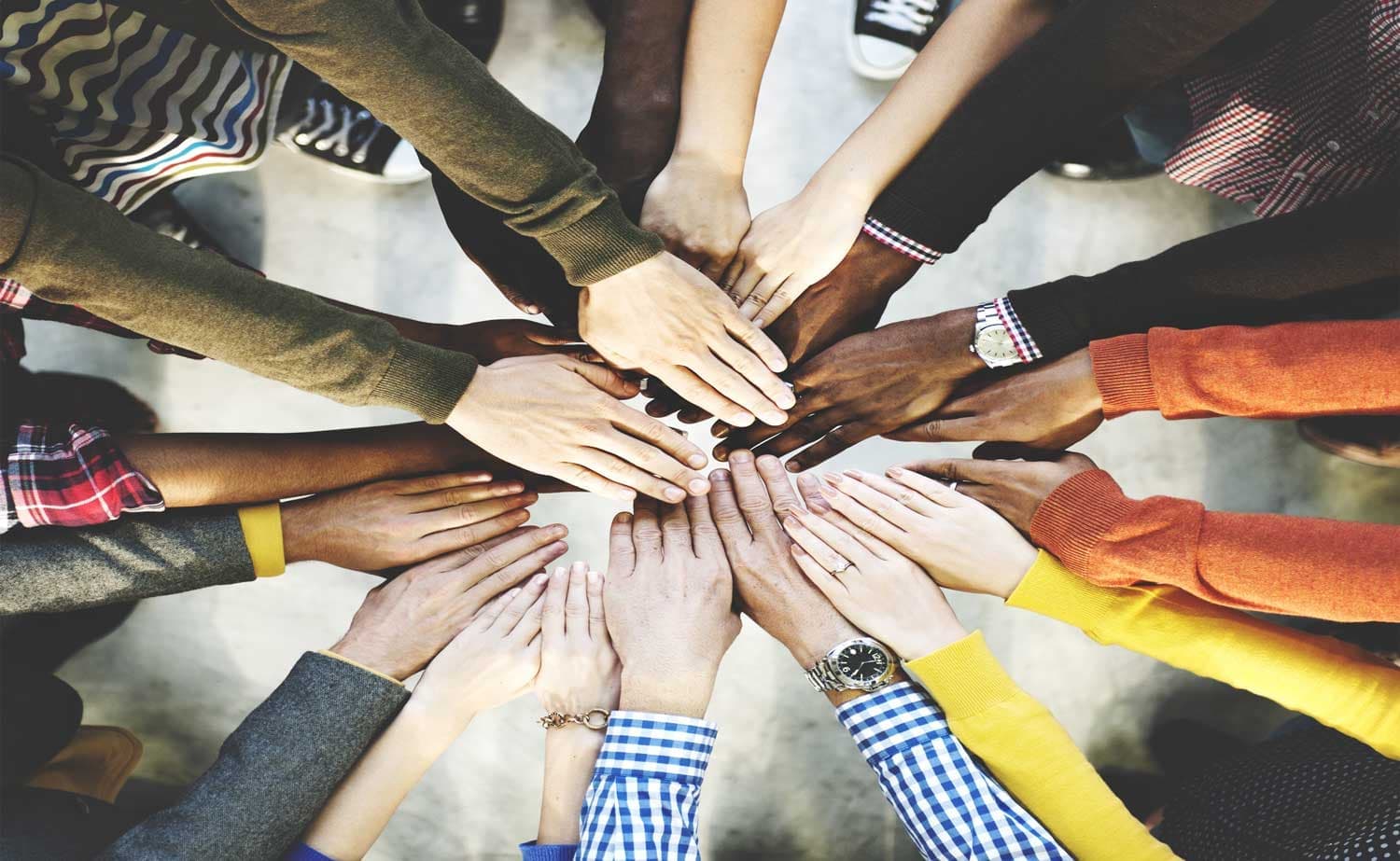 Hands joined together to represent teamwork