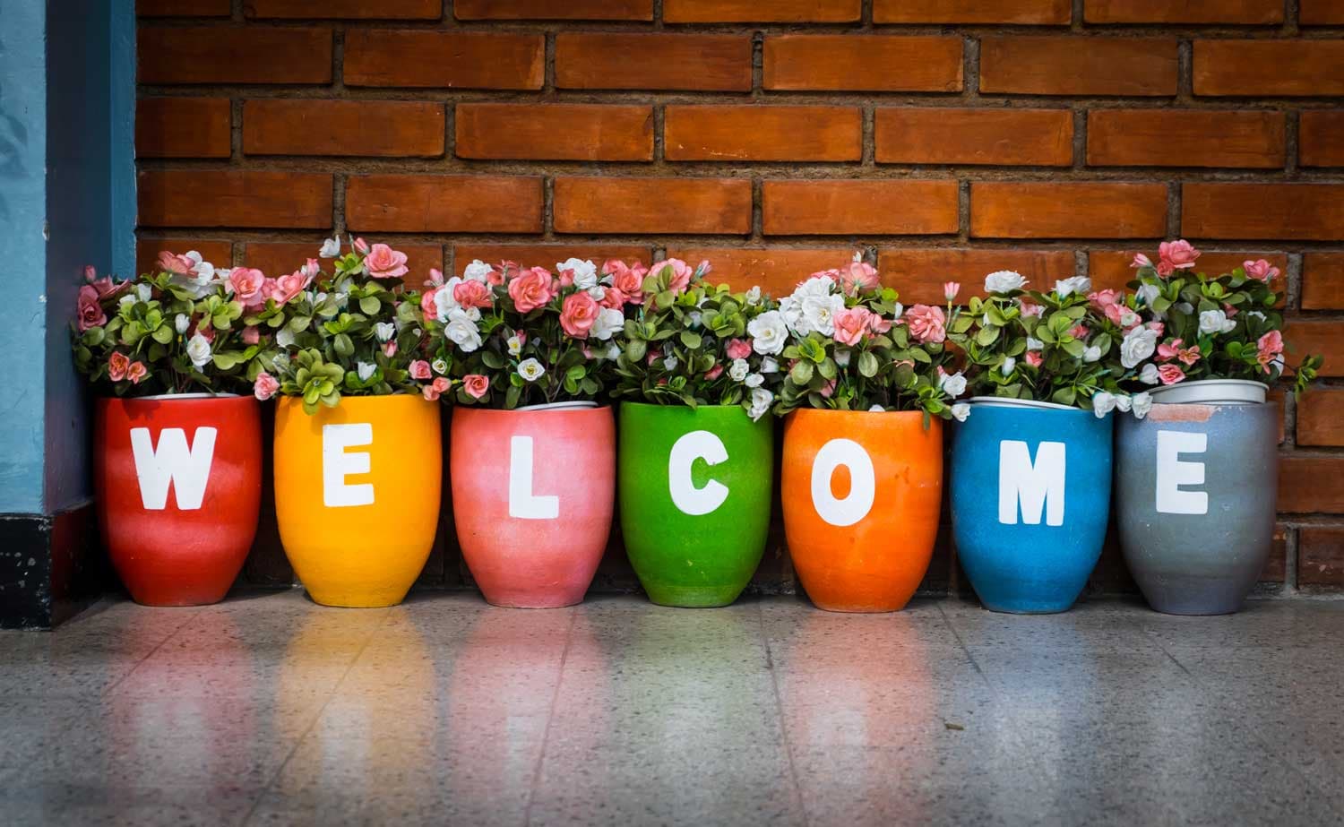 Colourful planters spelling welcome